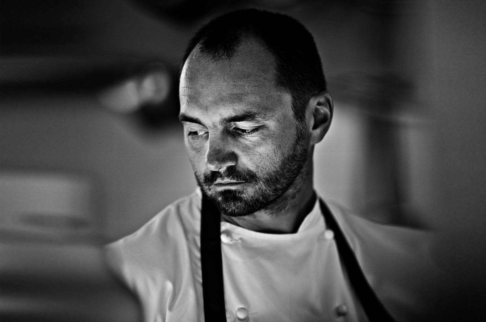 Portrait in black and white of double starred chef Christophe Aribert