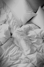 white bed in a hotel room of Maison Aribert